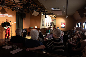 Dave Ross playing electric guitar and singing in City Sessions #1 at Dixon Place